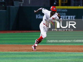 Aristides Aquino #56 of Diablos Rojos runs back to second base during match 1 against Sultanes de Monterrey of the Mexican Baseball League (...