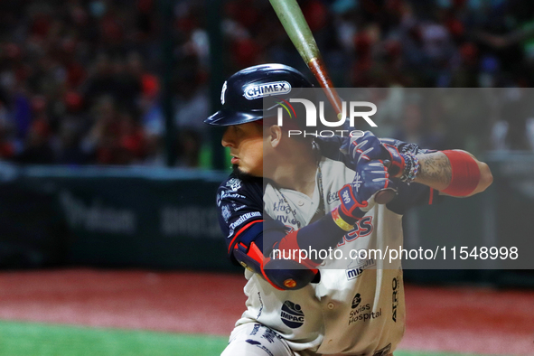 Ramiro Pena #19 of Sultanes de Monterrey bats during match 1 against Diablos Rojos of the Mexican Baseball League (LMB) Serie del Rey at the...