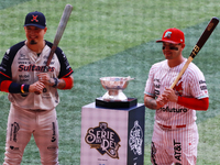 Ramiro Pena #1 of Sultanes de Monterrey and Juan Carlos Gamboa #47 of Diablos Rojos pose with the Zaachila trophy before match 1 of the Mexi...