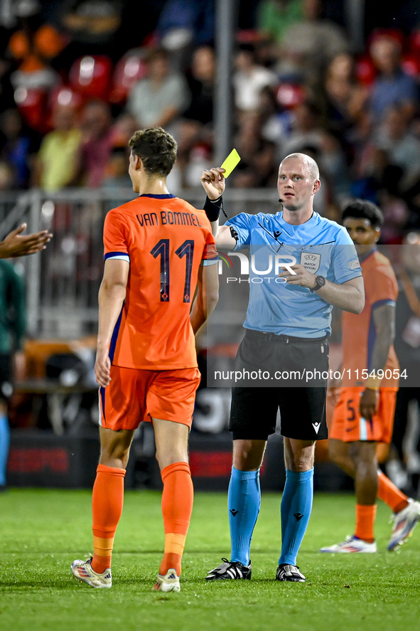 Referee Ivar Orri Kristjansson shows a yellow card to Netherlands player Ruben van Bommel during the match between the Netherlands and North...