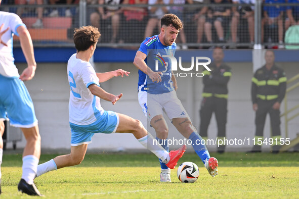 Matteo Guidi (SMR) and Matteo Ruggeri (ITA) during the UEFA U21 Euro 2025 Qualifier match between Italy and San Marino at the Domenico Franc...