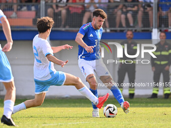 Matteo Guidi (SMR) and Matteo Ruggeri (ITA) during the UEFA U21 Euro 2025 Qualifier match between Italy and San Marino at the Domenico Franc...