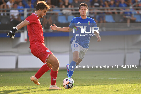 Pietro Amici (SMR) and Niccolo Pisilli (ITA) during the UEFA U21 Euro 2025 Qualifier match between Italy and San Marino at the Domenico Fran...