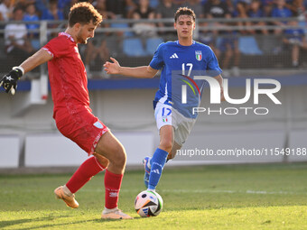 Pietro Amici (SMR) and Niccolo Pisilli (ITA) during the UEFA U21 Euro 2025 Qualifier match between Italy and San Marino at the Domenico Fran...