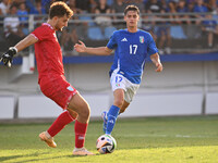 Pietro Amici (SMR) and Niccolo Pisilli (ITA) during the UEFA U21 Euro 2025 Qualifier match between Italy and San Marino at the Domenico Fran...