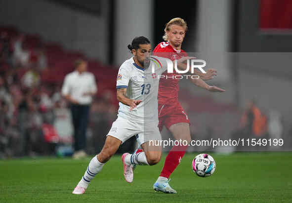 Joel Monteiro of Switzerland and Kasper Dolberg of Denmark battle for the ball during the UEFA Nations League 2024/2025 League A - Group 4 m...