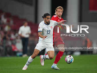 Joel Monteiro of Switzerland and Kasper Dolberg of Denmark battle for the ball during the UEFA Nations League 2024/2025 League A - Group 4 m...