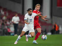 Joel Monteiro of Switzerland and Kasper Dolberg of Denmark battle for the ball during the UEFA Nations League 2024/2025 League A - Group 4 m...