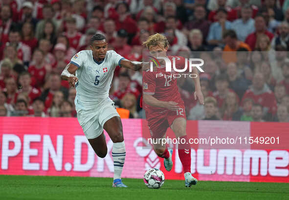 Kasper Dolberg of Denmark and Manuel Akanji of Switzerland battle for the ball during the UEFA Nations League 2024/2025 League A - Group 4 m...