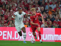 Kasper Dolberg of Denmark and Manuel Akanji of Switzerland battle for the ball during the UEFA Nations League 2024/2025 League A - Group 4 m...