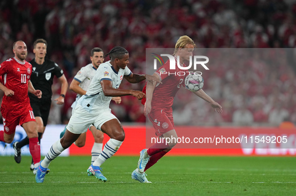 Kasper Dolberg of Denmark and Manuel Akanji of Switzerland battle for the ball during the UEFA Nations League 2024/2025 League A - Group 4 m...