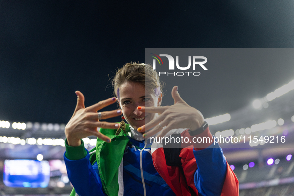 Martina Caironi of Italy reacts after the Women's Long Jump - T63 where she wins the silver medal at Stade de France during the Paris 2024 P...