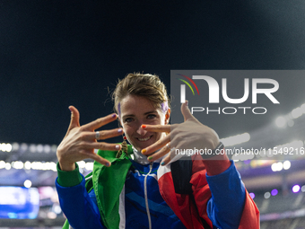 Martina Caironi of Italy reacts after the Women's Long Jump - T63 where she wins the silver medal at Stade de France during the Paris 2024 P...