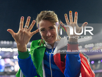 Martina Caironi of Italy reacts after the Women's Long Jump - T63 where she wins the silver medal at Stade de France during the Paris 2024 P...