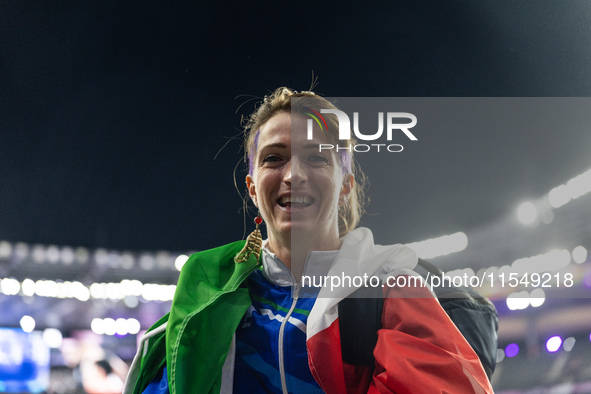 Martina Caironi of Italy reacts after the Women's Long Jump - T63 where she wins the silver medal at Stade de France during the Paris 2024 P...