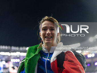 Martina Caironi of Italy reacts after the Women's Long Jump - T63 where she wins the silver medal at Stade de France during the Paris 2024 P...