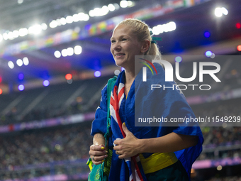 Vanessa Low of Australia reacts after winning the gold medal in the Women's Long Jump - T63 at Stade de France during the Paris 2024 Paralym...