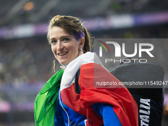 Martina Caironi of Italy reacts after the Women's Long Jump - T63 where she wins the silver medal at Stade de France during the Paris 2024 P...