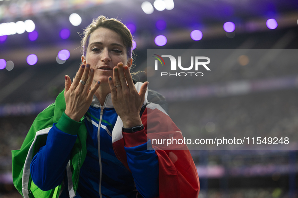 Martina Caironi of Italy reacts after the Women's Long Jump - T63 where she wins the silver medal at Stade de France during the Paris 2024 P...