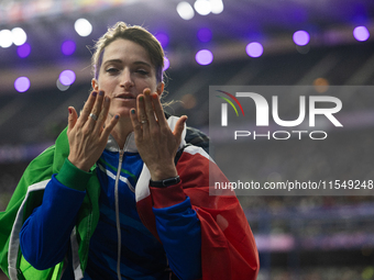 Martina Caironi of Italy reacts after the Women's Long Jump - T63 where she wins the silver medal at Stade de France during the Paris 2024 P...