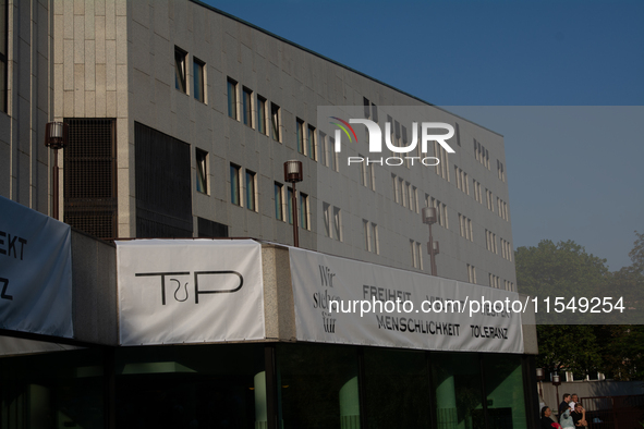 A banner reading ''Freedom, diversity and respect, human rights and tolerance'' hangs on the other buildings of Essen Philharmonie as thousa...