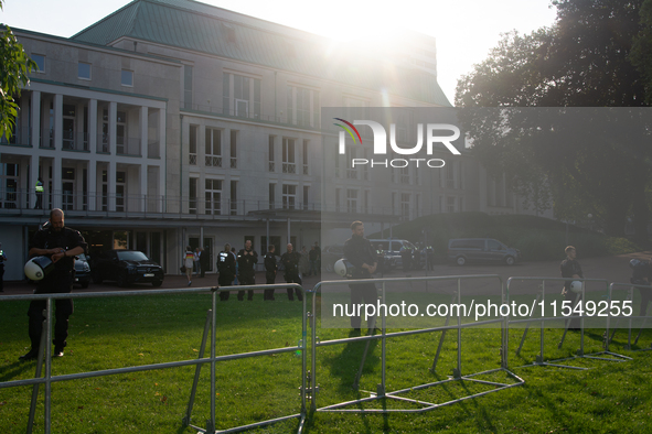 Police force guards the AFD event area as thousands of people take part in a demonstration against the AF politician event for community dia...