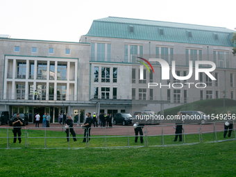 Police force guards the AFD event area as thousands of people take part in a demonstration against the AF politician event for community dia...