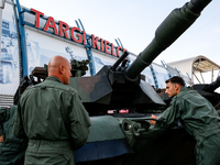 Servicemen stand by Abrams tank as they attends the 32nd International Defence Industry Exhibition - MSPO i Targi Kielce in central Poland o...