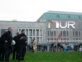 Police force guards the AFD event area as thousands of people take part in a demonstration against the AF politician event for community dia...