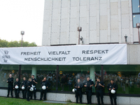 A banner reading ''Freedom, diversity and respect, human rights and tolerance'' hangs on the other buildings of Essen Philharmonie as thousa...