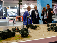 Visitors look at exhibitions as they attend the 32nd International Defence Industry Exhibition - MSPO i Targi Kielce in central Poland on Se...