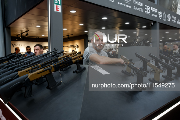 A presenter stands in UM Pavilion 32nd International Defence Industry Exhibition - MSPO i Targi Kielce in central Poland on September 5, 202...