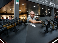 A presenter stands in UM Pavilion 32nd International Defence Industry Exhibition - MSPO i Targi Kielce in central Poland on September 5, 202...