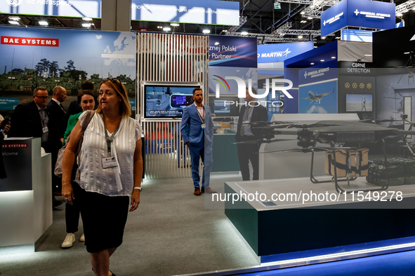 Visitors walk in BAE Systems Pavilion as they attend the 32nd International Defence Industry Exhibition - MSPO i Targi Kielce in central Pol...