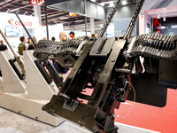 Visitors look at guns from Beretta Defence Technologies as they attend the 32nd International Defence Industry Exhibition - MSPO i Targi Kie...