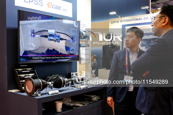 Visitors look at Korean armour systems as they attend the 32nd International Defence Industry Exhibition - MSPO i Targi Kielce in central Po...