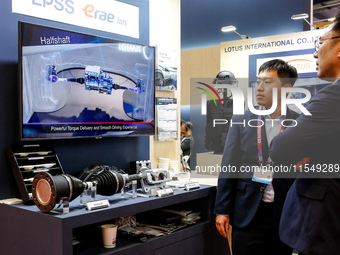 Visitors look at Korean armour systems as they attend the 32nd International Defence Industry Exhibition - MSPO i Targi Kielce in central Po...