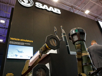 Visitors look at armour units from Saab as they attend the 32nd International Defence Industry Exhibition - MSPO i Targi Kielce in central P...