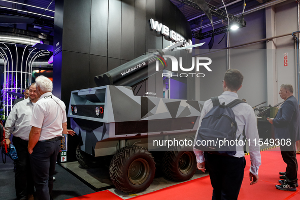 Visitor look at Lewiatan unmenned combat vehicle from WB Group as they attends the 32nd International Defence Industry Exhibition - MSPO i T...