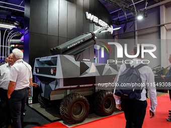 Visitor look at Lewiatan unmenned combat vehicle from WB Group as they attends the 32nd International Defence Industry Exhibition - MSPO i T...