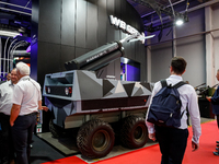 Visitor look at Lewiatan unmenned combat vehicle from WB Group as they attends the 32nd International Defence Industry Exhibition - MSPO i T...