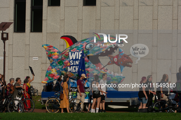 A carnival float is seen as thousands of people take part in a demonstration against an AF politician event for community dialogue at Essen...