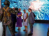 Visitor look at mannequin with a drone from WB Group as they attends the 32nd International Defence Industry Exhibition - MSPO i Targi Kielc...