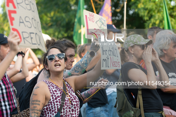 Thousands of people take part in a demonstration against an AF politician event for community dialogue at Essen Philharmonic Hall in Essen,...