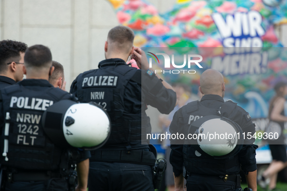 Police force guards the AFD event area as thousands of people take part in a demonstration against the AF politician event for community dia...