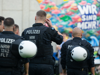 Police force guards the AFD event area as thousands of people take part in a demonstration against the AF politician event for community dia...