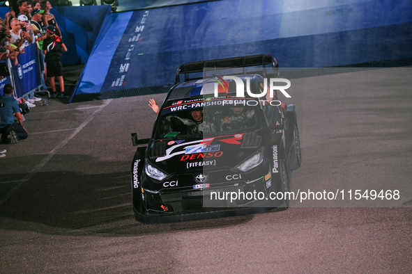 Driver Sebastien Ogier and co-driver Vincent Landais of the team Toyota Gazoo Racing WRT, Toyota GR Yaris Rally1 Hybrid, face the ceremonial...