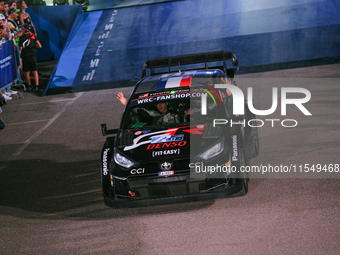 Driver Sebastien Ogier and co-driver Vincent Landais of the team Toyota Gazoo Racing WRT, Toyota GR Yaris Rally1 Hybrid, face the ceremonial...