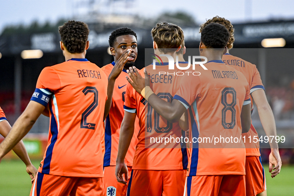 Netherlands player Devyne Rensch, Netherlands player Noah Ohio, Netherlands player Youri Regeer, and Netherlands player Antoni Milambo durin...