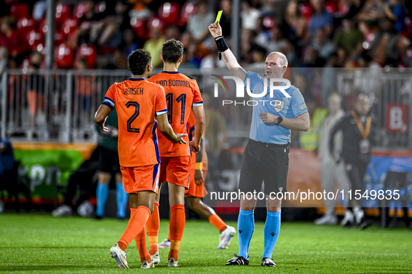 Referee Ivar Orri Kristjansson shows a yellow card to Netherlands player Ruben van Bommel during the match between the Netherlands and North...